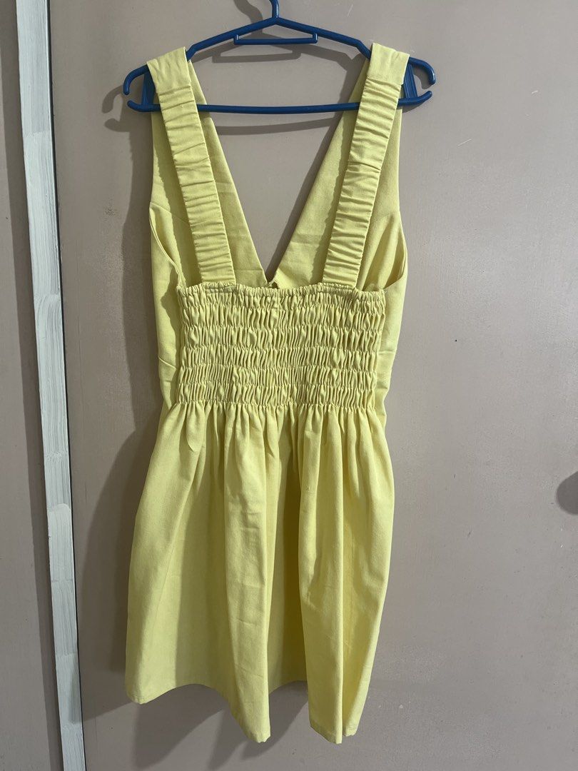 Yellow V-Neck Smocked Back Mini Dress (Category: Dresses) located in Quezon City. Submitted by lune17 (Listing ID 1458544864, Image 2). Description: - Adorable yellow mini dress - Flattering V-neck front - Comfortable smocked back - Sleeveless design - Ideal for casual wear or beach trips - Versatile styling with sandals or sneakers.