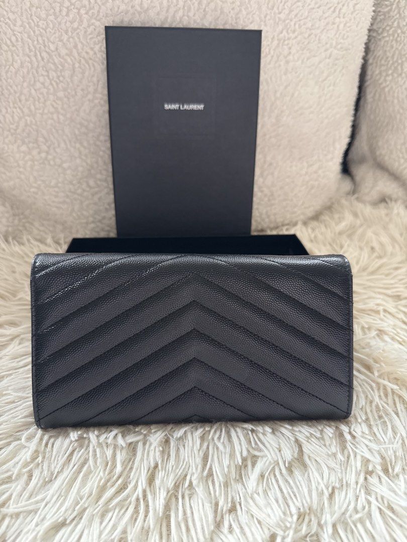 YSL Long Wallet (Category: Luxury Bags & Wallets) located in Manila. Submitted by ccluxuryy (Listing ID 1458561808, Image 3). Description: Saint Laurent Cassandre Matelasse Large Flap Wallet Grained Leather Black GHW Very good condition with normal signs of usage Comes full box with cards P26k only ✨ Location: Merville, Paranaque Meet up: MOA, Newport, Greenbelt, BGC Delivery: Grab, Lalamove or LBC Guaranteed authentic or money back 💯.