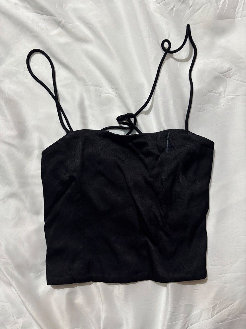Zara Black Spaghetti Strap Backless Crop Top (Category: Sleeveless) located in Mandaluyong City. Submitted by mini.declutter (Listing ID 1458520796, Image 1). Description: - Black spaghetti strap crop top - Square neckline - Ties at the back - Silky material - Ideal for pairing with high-waisted bottoms - Perfect for nights out.