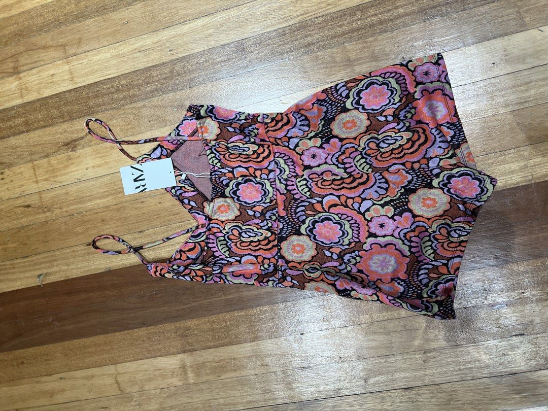 Zara Floral Print Spaghetti Strap Romper (Category: Rompers) located in Quezon City. Submitted by iminquezoncity (Listing ID 1458614599, Image 2). Description: - Cute Zara romper with vibrant floral print - Features spaghetti straps and a flattering V-neckline - Slight textured fabric - Perfect for casual day out or beach trip - Size: S - Original Price: 1,495 PHP.