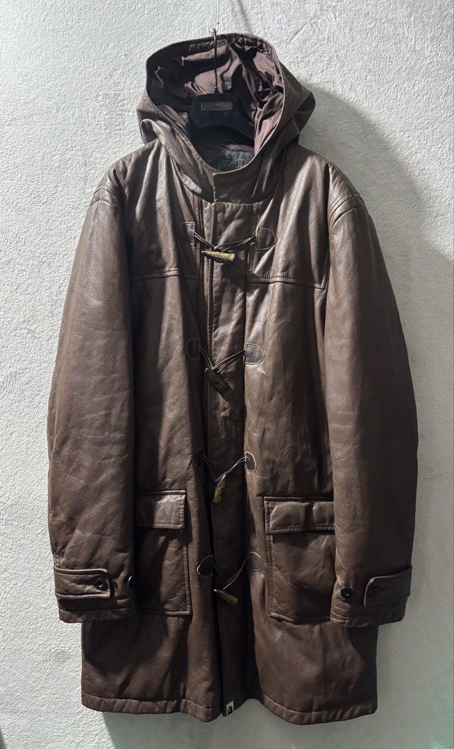 2000s Nigo Era Bape Leather Duffle Coat (Category: Coats, Jackets and Outerwear) located in Baguio. Submitted by thecollector2600 (Listing ID 1458813418, Image 1). Description: Originating from the prime Nigo era of the early 2000s, this heavyweight duffle coat exemplifies A Bathing Ape’s elevated luxury streetwear output under Nowhere Co., Ltd. Constructed from supple full-grain brown cowhide, the garment integrates traditional outerwear element