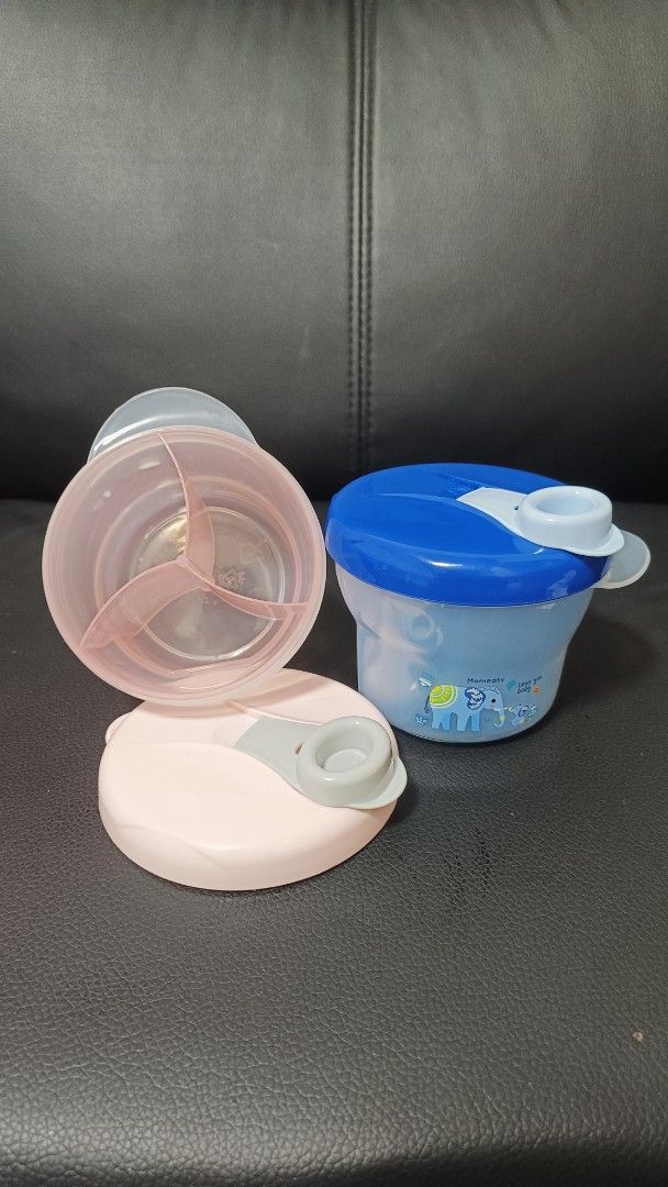 2pcs Baby Milk Powder Snack Container Dispenser (Category: Weaning & Toddler Feeding) located in Malabon City. Submitted by yngrid.salcedo (Listing ID 1458764778, Image 2). Description: Set of 2 baby food containers: 1 pink (3 compartments) and 1 blue (elephant design). Both have lids and spouts. Perfect for snacks or milk powder on the go. Easy to clean and carry..