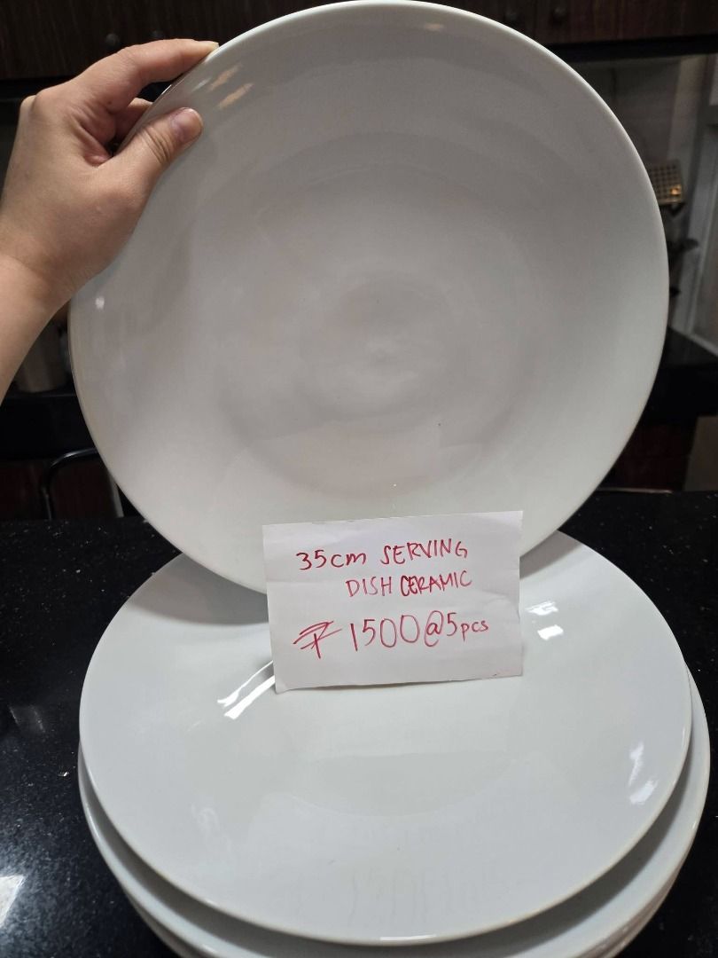 35cm Ceramic Serving Dish - Set of 5 (Category: Dinnerware & Cutlery) located in Makati City. Submitted by maggayj98 (Listing ID 1458758214, Image 1). Description: - Set of 5 ceramic serving dishes - Each dish measures 35cm - Classic and simple white design - Ideal for serving guests or family meals - Suitable for everyday use and special occasions.