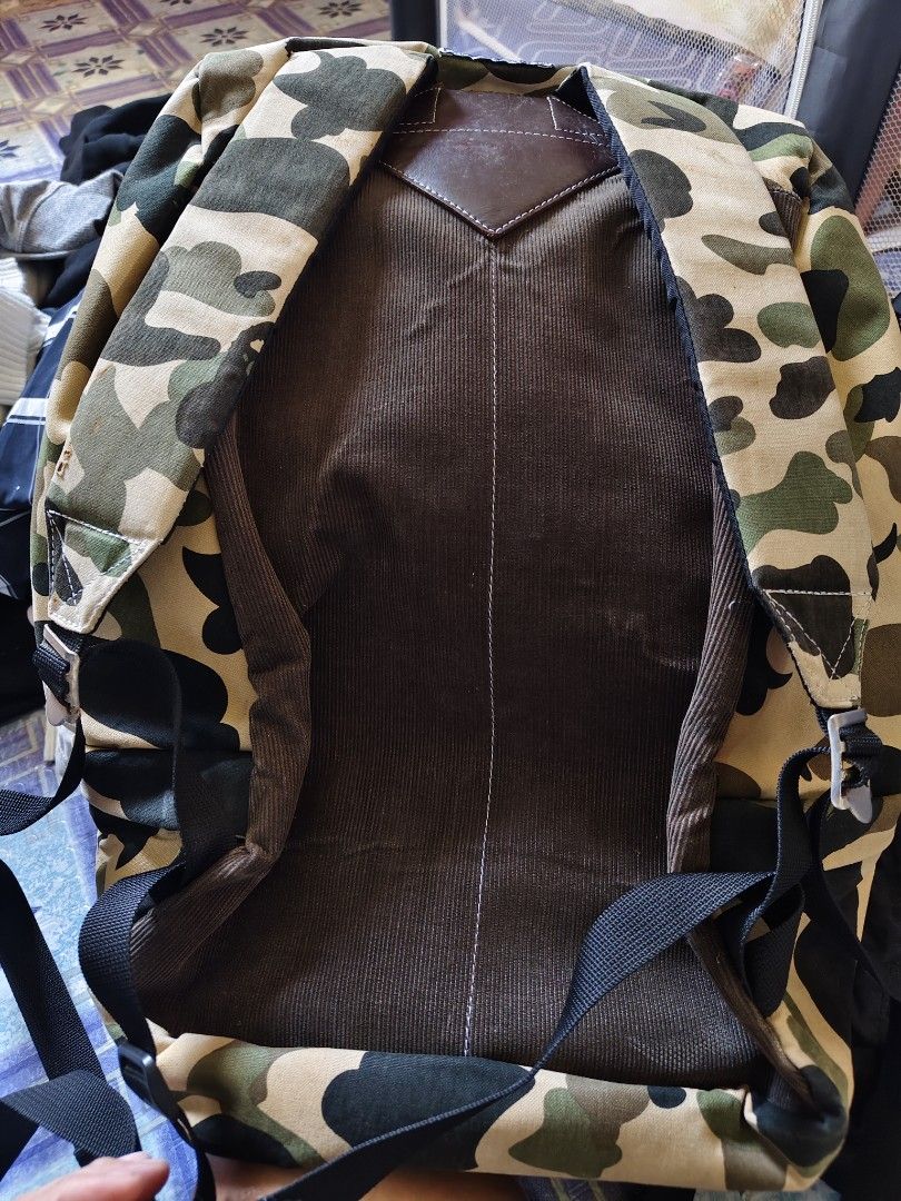 A Bathing Ape Camo Backpack (Category: Backpacks) located in Tagbilaran City. Submitted by bossjepoy (Listing ID 1458699154, Image 3). Description: - Iconic A Bathing Ape (BAPE) ABC Camo pattern - Multiple leather patches with embossed BAPE logos - Comfortable corduroy-lined back panel - Secure zipper closure with stylish leather pull tabs - Versatile for everyday use or travel.