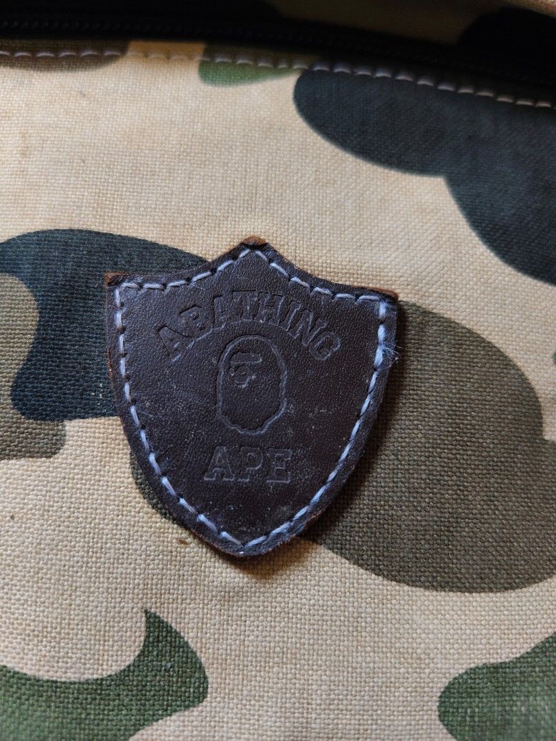 A Bathing Ape Camo Backpack (Category: Backpacks) located in Tagbilaran City. Submitted by bossjepoy (Listing ID 1458699154, Image 2). Description: - Iconic A Bathing Ape (BAPE) ABC Camo pattern - Multiple leather patches with embossed BAPE logos - Comfortable corduroy-lined back panel - Secure zipper closure with stylish leather pull tabs - Versatile for everyday use or travel.