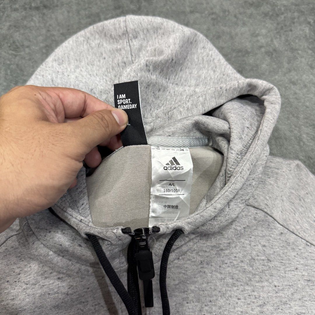 ADIDAS ID STADIUM HOODIE (Category: Coats, Jackets and Outerwear) located in Santa Maria. Submitted by rarefindslt (Listing ID 1458885524, Image 2). Description: ADIDAS ID STADIUM HOODIE (SWIPE LEFT FOR MORE DETAILS..) L on tag (best fit to M dimes) in solid gray color condition rate! complete tags for authenticity, solid side print adidas logo on sleeve, zipper working, adjustable string, side zippered pockets, stretchable cotton material, comfy