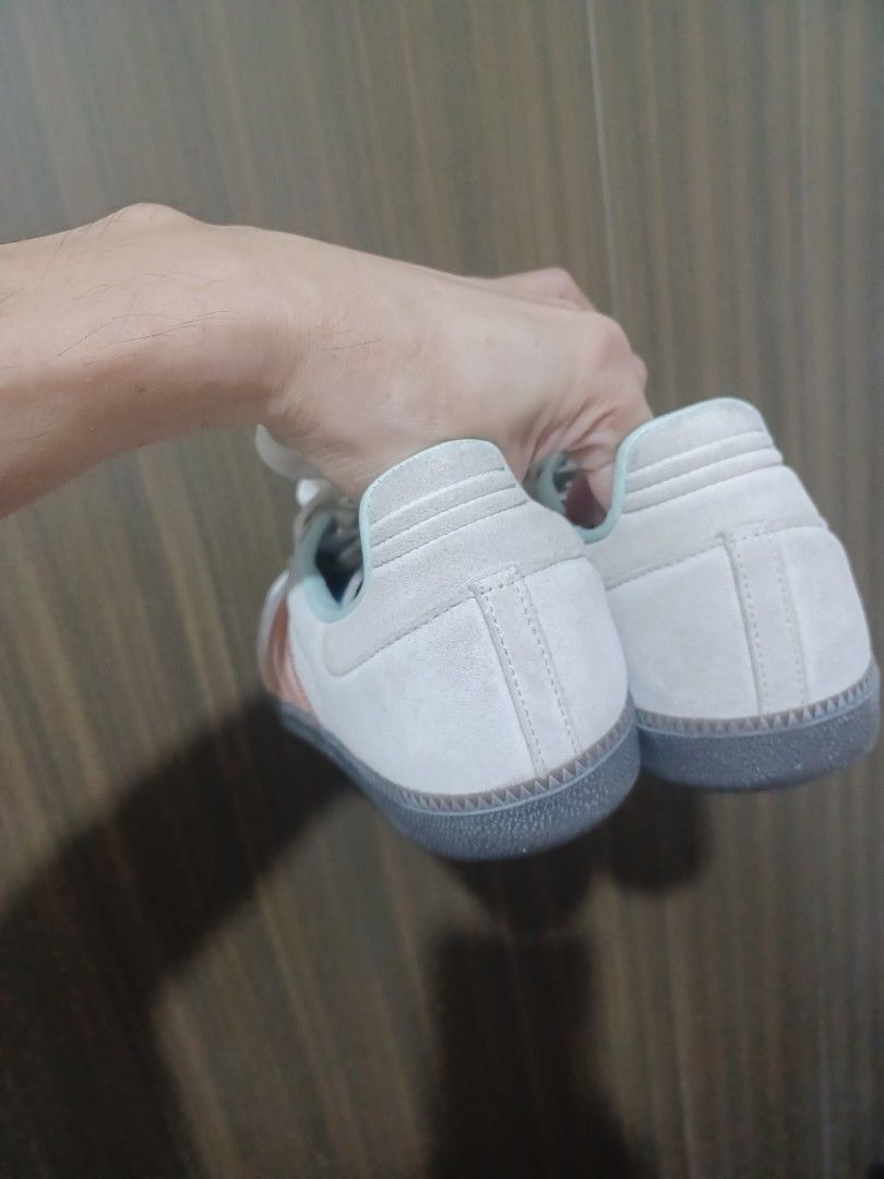 Adidas Samba Sneakers White Pink Stripes (Category: Sneakers) located in Mandaluyong City. Submitted by usamenfashionhaul (Listing ID 1458858813, Image 2). Description: - Classic Adidas Samba sneakers - White base with soft pink stripes - Suede and leather upper - Comfortable for everyday wear - Great for casual outfits - Get these iconic kicks!.