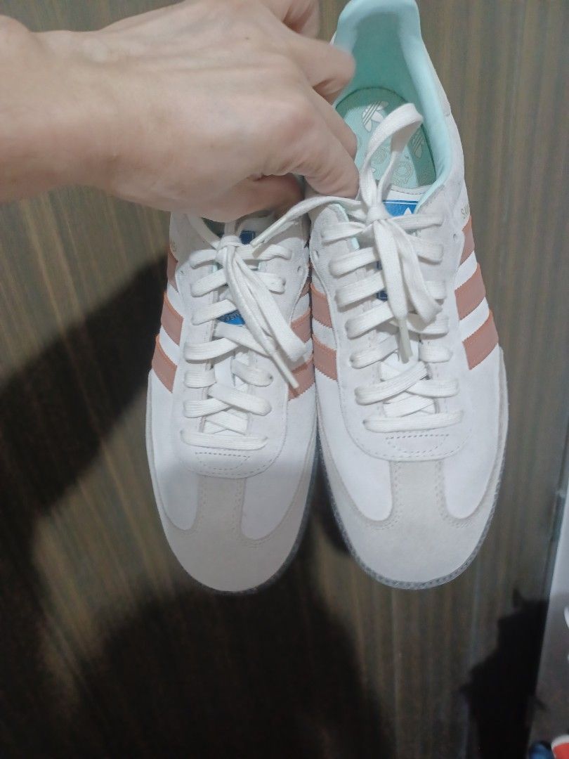 Adidas Samba Sneakers White Pink Stripes (Category: Sneakers) located in Mandaluyong City. Submitted by usamenfashionhaul (Listing ID 1458858813, Image 3). Description: - Classic Adidas Samba sneakers - White base with soft pink stripes - Suede and leather upper - Comfortable for everyday wear - Great for casual outfits - Get these iconic kicks!.