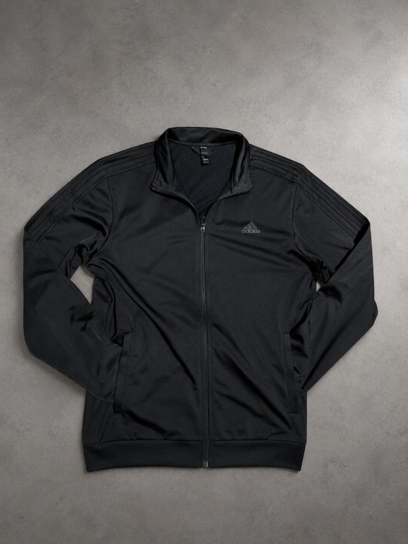 Adidas Track Jacket Black 3-Stripes Full Zip (Category: Coats, Jackets and Outerwear) located in Manila. Submitted by saltandlemon (Listing ID 1458811097, Image 1). Description: - Classic black Adidas track jacket for men - Iconic three stripes on sleeves - Full zip closure with stand-up collar - Two side pockets - Ideal for workouts or casual wear - Simple and versatile design.