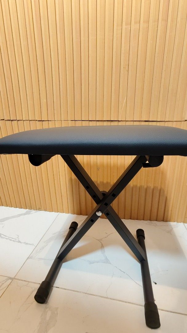 Adjustable Folding Piano Keyboard Bench Stool Seat (Category: Chairs) located in Bulacan. Submitted by babz30261 (Listing ID 1458805136, Image 1). Description: - Black padded seat for comfort - Folds flat for easy storage and transport - Sturdy X-frame design for stability - Rubber feet protect your floors - Ideal for practice or performance - Adjustable height for a perfect fit.