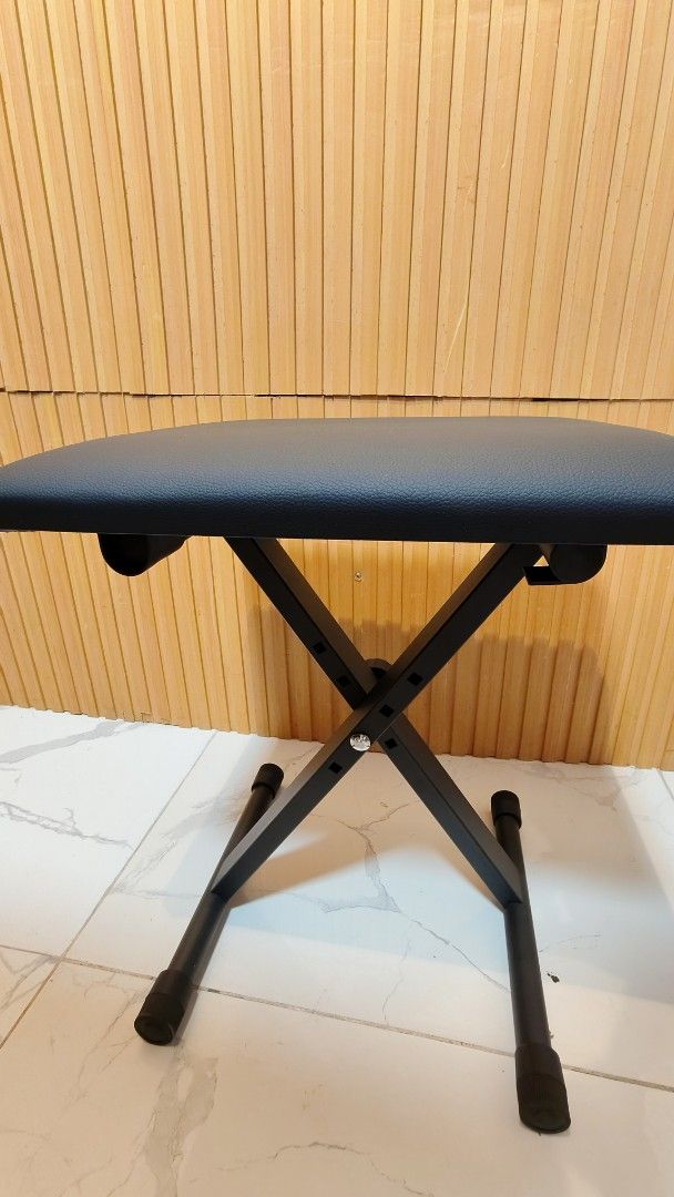 Adjustable Folding Piano Keyboard Bench Stool Seat (Category: Chairs) located in Bulacan. Submitted by babz30261 (Listing ID 1458805136, Image 2). Description: - Black padded seat for comfort - Folds flat for easy storage and transport - Sturdy X-frame design for stability - Rubber feet protect your floors - Ideal for practice or performance - Adjustable height for a perfect fit.