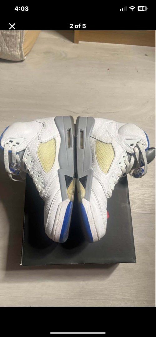 Air Jordan 5 Retro stealth (Category: Sneakers) located in Pasig City. Submitted by liamor222 (Listing ID 1458885045, Image 3). Description: - White Air Jordan 5s - Blue and grey accents - Mid-top silhouette - Classic Jordan branding - Visible Air unit in sole - Comes with original box - Ideal for collectors and sneakerheads.