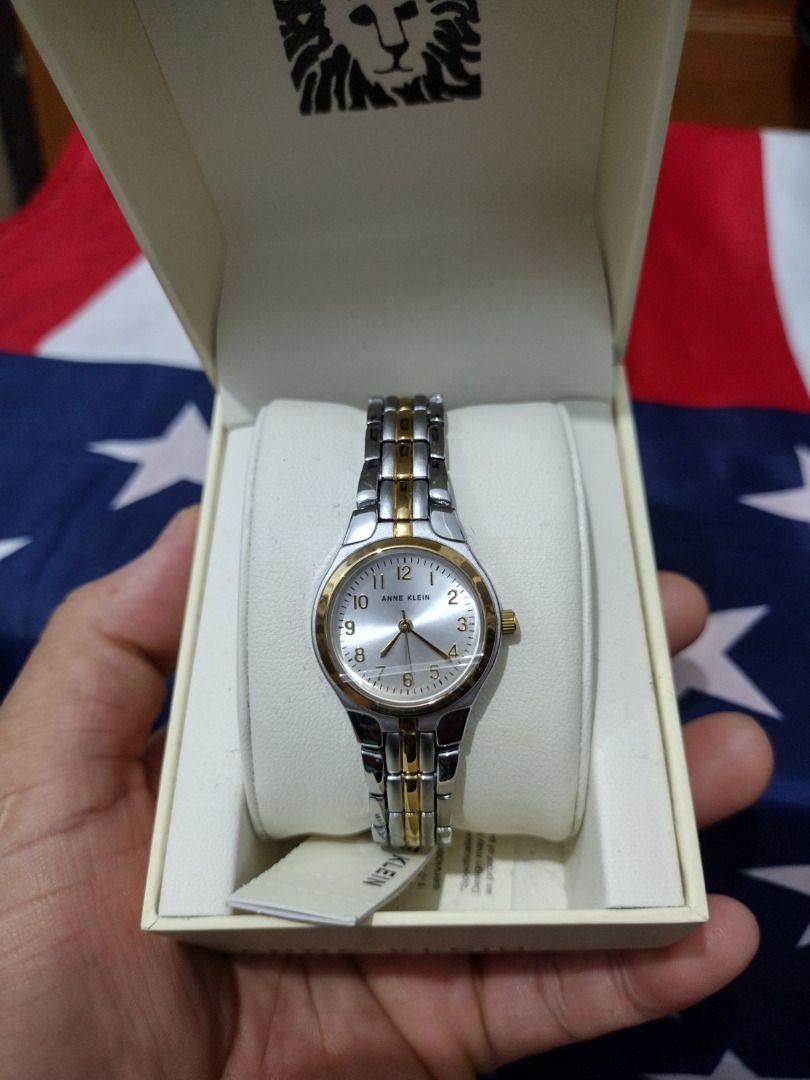 Anne Klein Two-Tone Watch (Category: Women's Watches) located in Caloocan City. Submitted by cha_essentials2026 (Listing ID 1458861325, Image 1). Description: - Anne Klein watch - Silver dial - Two-tone metal band (silver and gold) - Classic, elegant design - Includes original box - Ideal for everyday wear or special occasions.