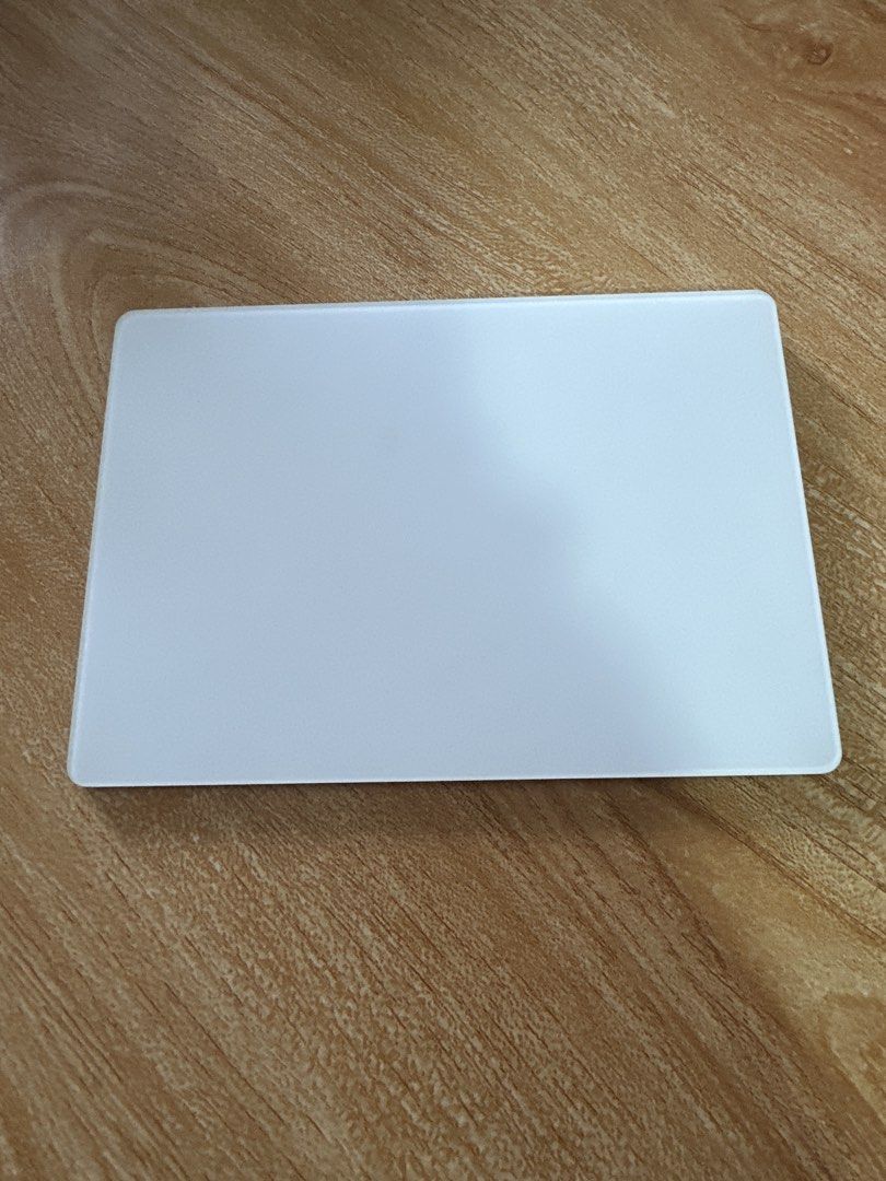 Apple Magic Trackpad Wireless Bluetooth White (Category: Mouse & Mousepads) located in Manila. Submitted by jkdee22 (Listing ID 1458698427, Image 2). Description: - Apple Magic Trackpad - Color: White - Connectivity: Wireless Bluetooth - Compatibility: Works with Mac computers - Condition: Minor surface scuffs from normal use, fully functional - Benefit: Enhances Mac navigation experience.