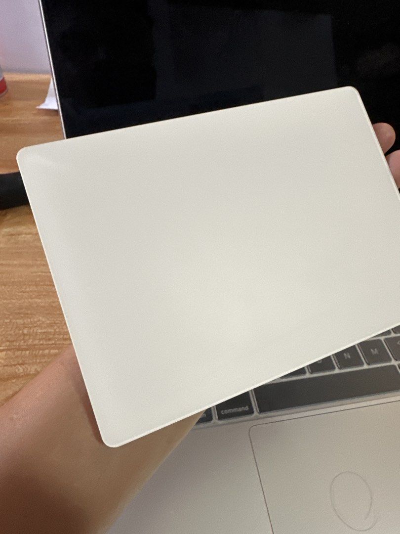 Apple Magic Trackpad Wireless Bluetooth White (Category: Mouse & Mousepads) located in Manila. Submitted by jkdee22 (Listing ID 1458698427, Image 1). Description: - Apple Magic Trackpad - Color: White - Connectivity: Wireless Bluetooth - Compatibility: Works with Mac computers - Condition: Minor surface scuffs from normal use, fully functional - Benefit: Enhances Mac navigation experience.