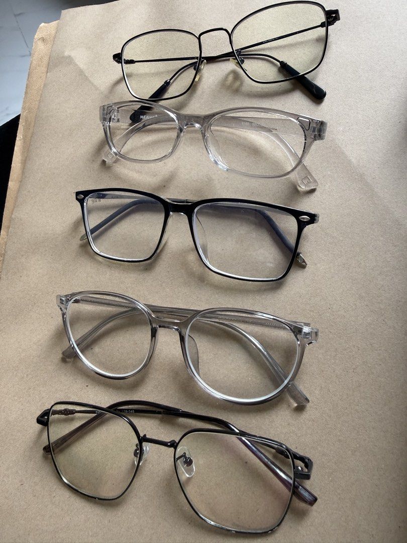 Assorted Eyeglasses - Blue Light Blocking & Fashion Frames (Category: Sunglasses & Eyewear) located in Cavite. Submitted by galoreforsale (Listing ID 1458703189, Image 3). Description: - Bundle of 5 pairs of eyeglasses - Features blue light blocking lenses - Stylish fashion frames in various designs - Colors include black, clear, and gunmetal - Suitable for everyday wear or as a fashion statement.