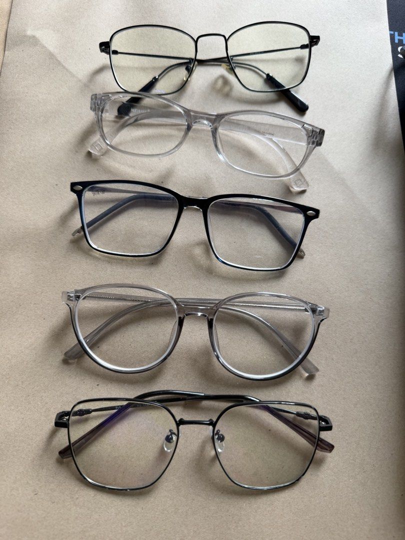 Assorted Eyeglasses - Blue Light Blocking & Fashion Frames (Category: Sunglasses & Eyewear) located in Cavite. Submitted by galoreforsale (Listing ID 1458703189, Image 1). Description: - Bundle of 5 pairs of eyeglasses - Features blue light blocking lenses - Stylish fashion frames in various designs - Colors include black, clear, and gunmetal - Suitable for everyday wear or as a fashion statement.