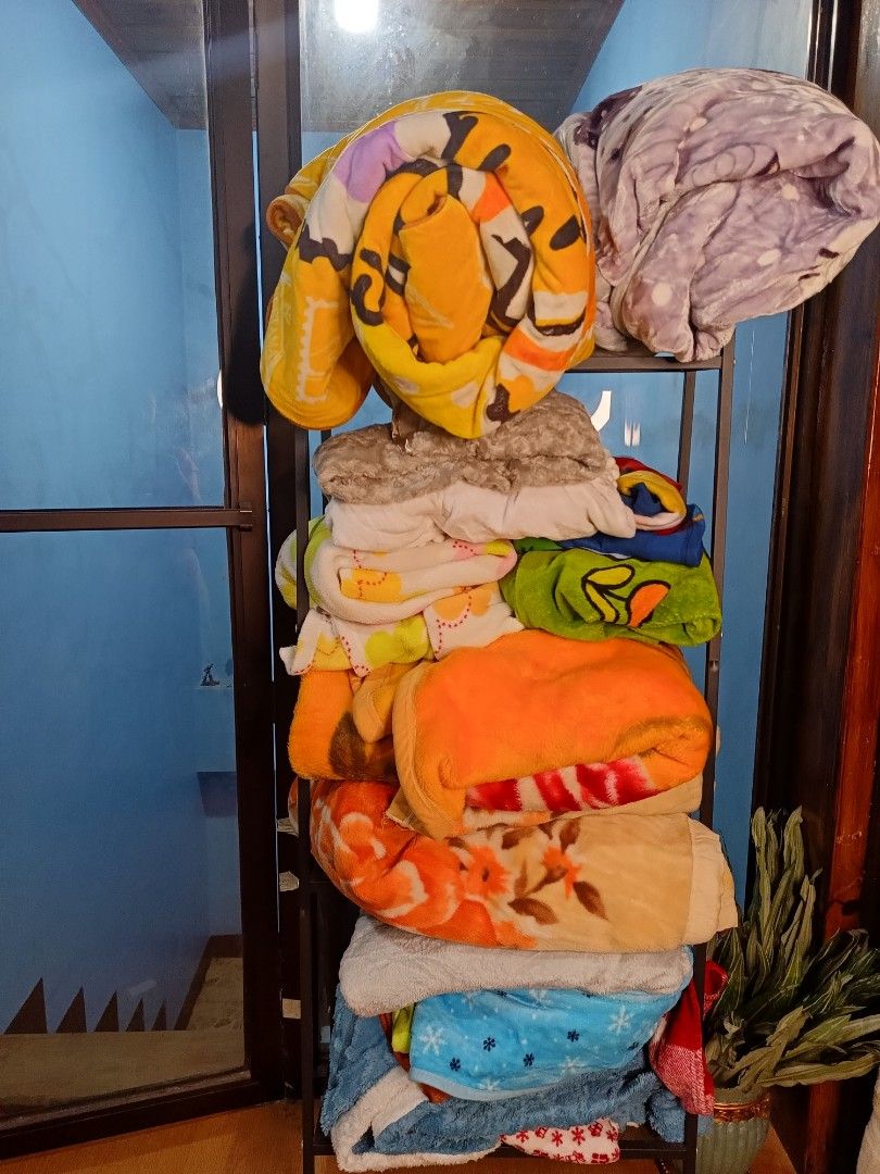 Assorted Fleece Blankets - Various Designs and Colors (Category: Bedding & Towels) located in Baguio. Submitted by alonasteph (Listing ID 1458834156, Image 1). Description: 17pcs for only 4,500 from HK box - Bundle of soft fleece blankets - Includes yellow cartoon blanket - Includes purple patterned blanket - Assorted other blankets in various colors/designs - Great for warmth or decoration - All blankets are clean and ready for a new home.