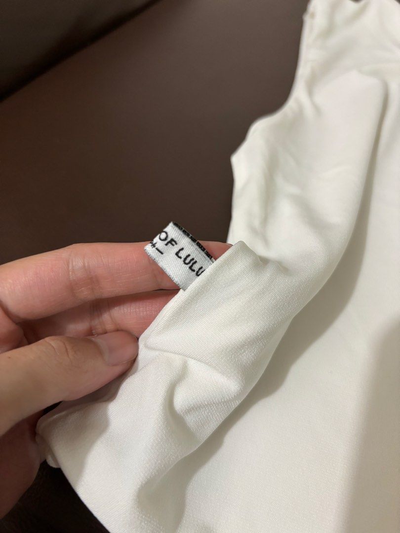 Asymmetrical Top (Category: Blouses) located in Pasig City. Submitted by theclutterqueen (Listing ID 1458770818, Image 3). Description: House of Lulu asymmetrical top 🤍 Preloved, good condition RFS: Decluttering PM if interested 😊.