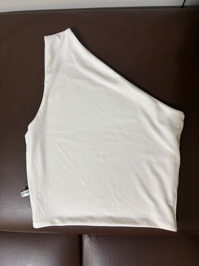 Asymmetrical Top (Category: Blouses) located in Pasig City. Submitted by theclutterqueen (Listing ID 1458770818, Image 1). Description: House of Lulu asymmetrical top 🤍 Preloved, good condition RFS: Decluttering PM if interested 😊.