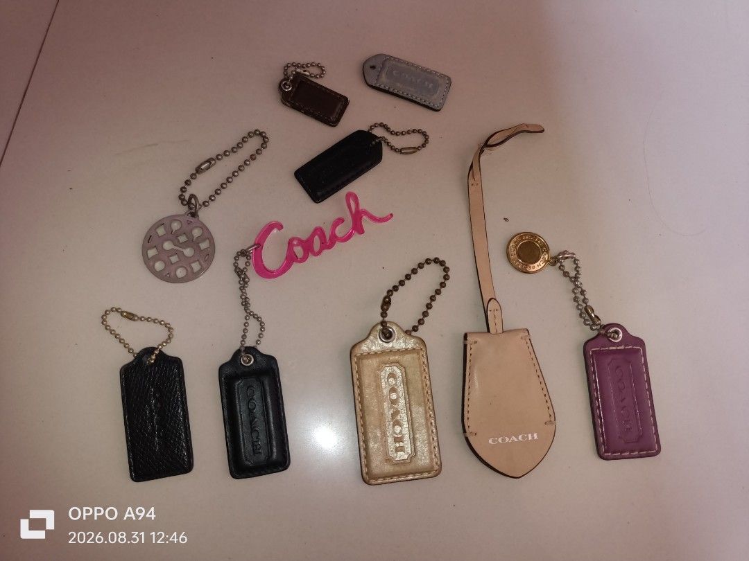 Authentic Coach Bag Charms - Assorted Styles (Category: Charms) located in Batangas. Submitted by ponylittle37795 (Listing ID 1458727018, Image 1). Description: - Genuine Coach bag charms - Available in black, tan, purple, and grey - Some feature embossed Coach logo - Perfect for personalizing handbags - Great gift idea - Authentic Coach accessories.