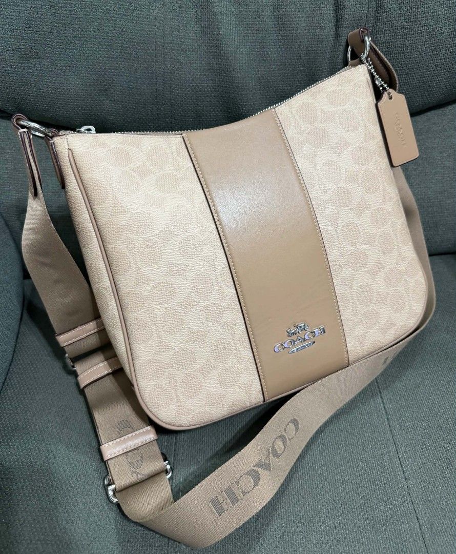 Authentic Coach Signature Ellie File Bav (Category: Cross-body Bags) located in Quezon City. Submitted by luxxechic (Listing ID 1458751172, Image 2). Description: with creed with hang tag good as new no issue actual photo posted mop: gcash.