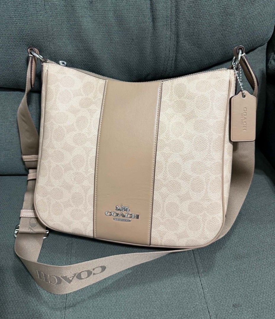 Authentic Coach Signature Ellie File Bav (Category: Cross-body Bags) located in Quezon City. Submitted by luxxechic (Listing ID 1458751172, Image 1). Description: with creed with hang tag good as new no issue actual photo posted mop: gcash.