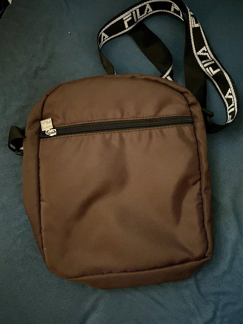 Fila Bag (Category: Sling Bags) located in Manila. Submitted by ryukk2311 (Listing ID 1458733932, Image 2). Description: Authenthic Fila Sling Bag Color: Chocolate Brown lalamove only, shoulder by buyer.