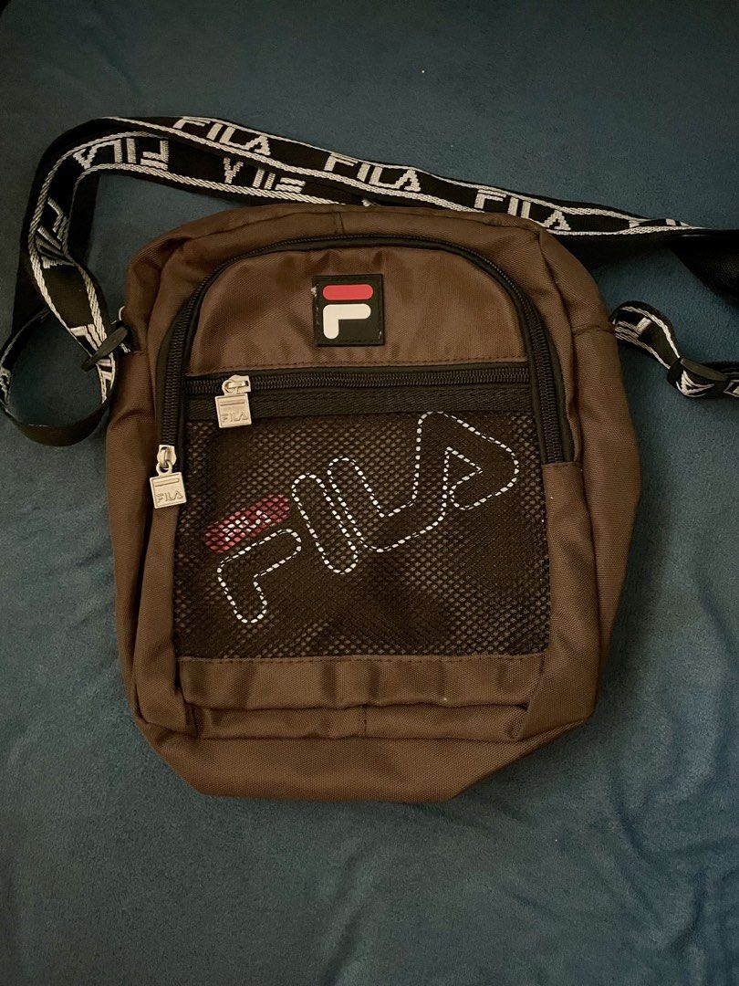 Fila Bag (Category: Sling Bags) located in Manila. Submitted by ryukk2311 (Listing ID 1458733932, Image 1). Description: Authenthic Fila Sling Bag Color: Chocolate Brown lalamove only, shoulder by buyer.