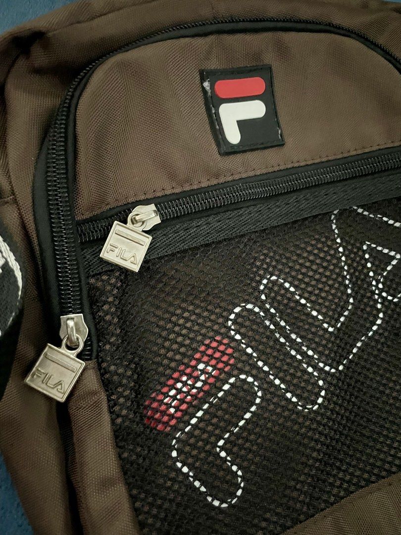 Fila Bag (Category: Sling Bags) located in Manila. Submitted by ryukk2311 (Listing ID 1458733932, Image 3). Description: Authenthic Fila Sling Bag Color: Chocolate Brown lalamove only, shoulder by buyer.