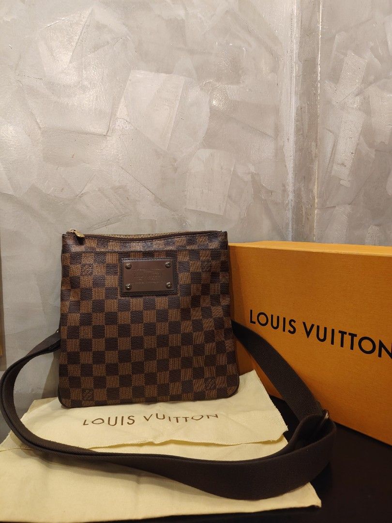 Authentic Louis Vuitton Brooklyn PM in Damier Ebene Canvas (Category: Luxury Bags & Wallets) located in Cagayan de Oro. Submitted by michaelluxuryitems (Listing ID 1458754864, Image 1). Description: ​Condition: Excellent pre-loved condition / Minimal signs of use ​Inclusions: Comes with original dustbag and box ​Details: ​Iconic Damier Ebene canvas with brown leather trim ​Front metal plate ("Louis Vuitton Inventeur") ​Top zip closure with spacio