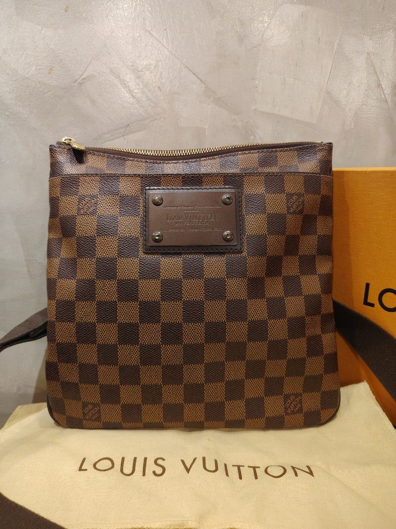 Authentic Louis Vuitton Brooklyn PM in Damier Ebene Canvas (Category: Luxury Bags & Wallets) located in Cagayan de Oro. Submitted by michaelluxuryitems (Listing ID 1458754864, Image 2). Description: ​Condition: Excellent pre-loved condition / Minimal signs of use ​Inclusions: Comes with original dustbag and box ​Details: ​Iconic Damier Ebene canvas with brown leather trim ​Front metal plate ("Louis Vuitton Inventeur") ​Top zip closure with spacio