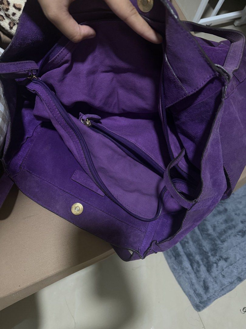 Authentic Michael Kors Purple Suede Tote Bag (Category: Luxury Bags & Wallets) located in Manila. Submitted by warmcat.b45a52 (Listing ID 1458842136, Image 2). Description: - Authentic Michael Kors purple suede tote bag - Large size, ideal for everyday essentials - Adorned with the signature MK logo charm - A stylish and practical addition to your collection - Issue shown on last slide: discoloration on edges.