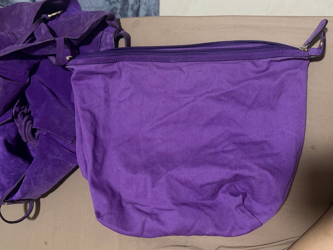 Authentic Michael Kors Purple Suede Tote Bag (Category: Luxury Bags & Wallets) located in Manila. Submitted by warmcat.b45a52 (Listing ID 1458842136, Image 3). Description: - Authentic Michael Kors purple suede tote bag - Large size, ideal for everyday essentials - Adorned with the signature MK logo charm - A stylish and practical addition to your collection - Issue shown on last slide: discoloration on edges.