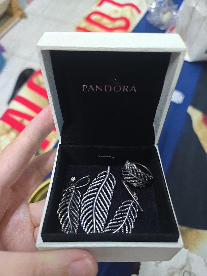 PANDORA Feather LEAF SET (Category: Earrings) located in Quezon City. Submitted by thegoodsplanetmnl (Listing ID 1458800411, Image 1). Description: Authentic Pandora Set Includes: Pendant Earrings Ring Size 8 can be purchase seperately at 3k each.
