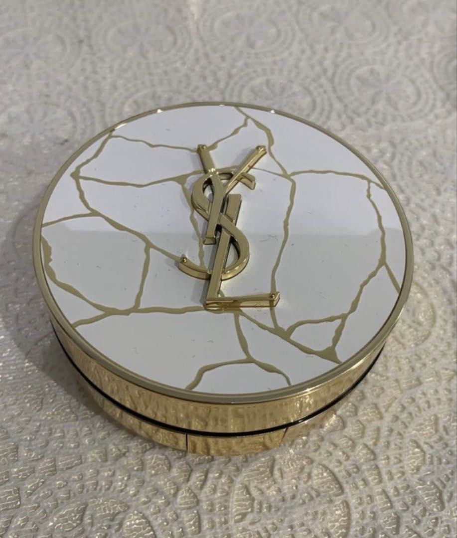 Authentic YSL Gold Rush Trio Highlighter Cushion (Category: Makeup) located in Mandaluyong City. Submitted by lgariba (Listing ID 1458744511, Image 1). Description: - YSL Gold Rush Trio Highlighter Cushion - Luminous highlighter, Collector's Edition - Comes with applicator puff - Elegant gold casing with white and gold cracked pattern design - Perfect for achieving a radiant glow - No more box.