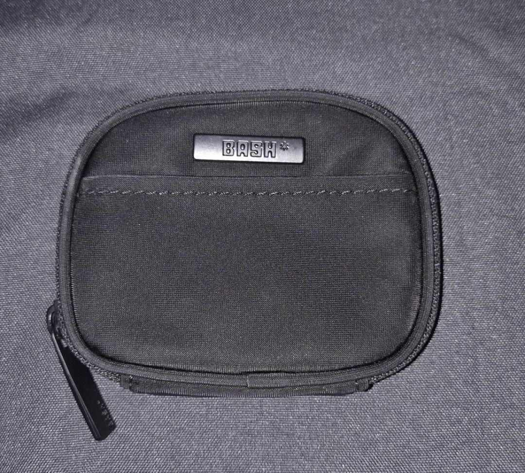 BASH Black Coin Pouch with Zipper and Detachable Strap (Category: Purses & Pouches) located in Pasig City. Submitted by bash0011 (Listing ID 1458781156, Image 2). Description: - Brand: BASH - Color: Black - Main compartment with zipper - Inner pocket - Front slip pocket - Detachable ring for easy carrying - Ideal for coins, cards, and small essentials.