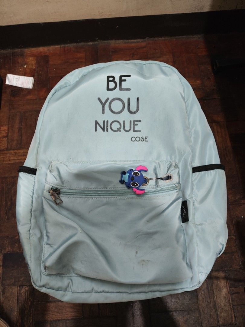 BE YOU NIQUE Light Blue Backpack with Stitch Keychain (Category: Shoulder Bags) located in Manila. Submitted by warmshark.1ae1ea (Listing ID 1458778702, Image 1). Description: ✨ Cute light blue backpack ✨ Spacious and lightweight design ✨ With side pockets and front compartment ✨ Includes Stitch keychain Condition: Used condition Some stains due to usage Back zipper is damaged/not working, but bag is still usable RFS: Not using anymore.