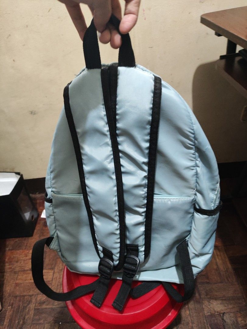 BE YOU NIQUE Light Blue Backpack with Stitch Keychain (Category: Shoulder Bags) located in Manila. Submitted by warmshark.1ae1ea (Listing ID 1458778702, Image 3). Description: ✨ Cute light blue backpack ✨ Spacious and lightweight design ✨ With side pockets and front compartment ✨ Includes Stitch keychain Condition: Used condition Some stains due to usage Back zipper is damaged/not working, but bag is still usable RFS: Not using anymore.