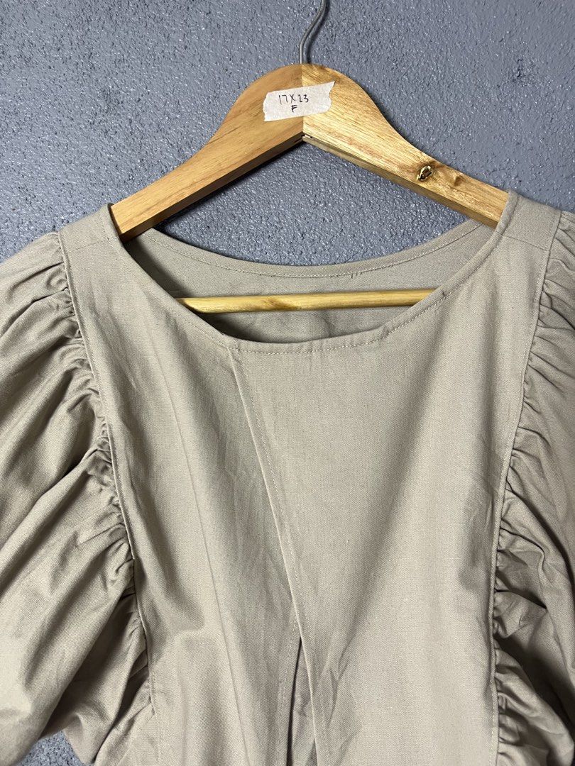 Beige Puff Sleeve Tie Back Crop Top (Category: Blouses) located in Famy. Submitted by basicthrifted (Listing ID 1458728216, Image 2). Description: - Cute beige crop top - Features stylish puff sleeves - Adjustable tie-back detail - Comfortable cotton blend fabric - Versatile for casual outings or dressing up - Pairs perfectly with high-waisted bottoms.
