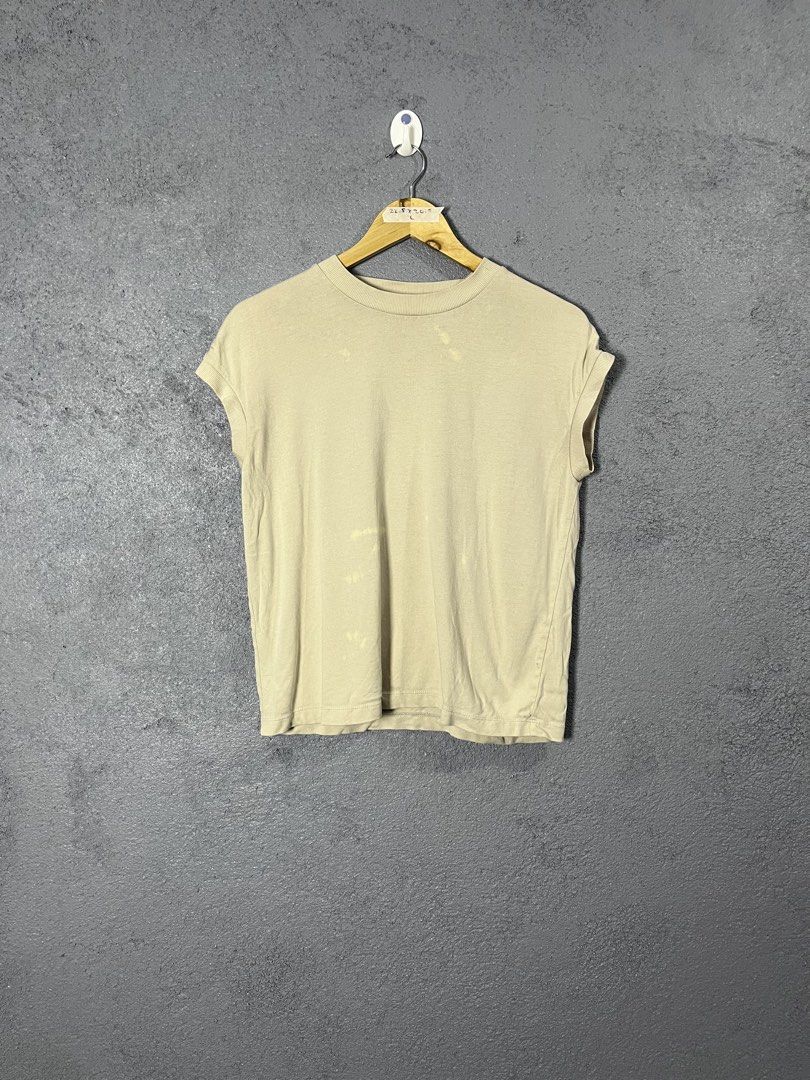 Beige T-shirt Size L (Category: Others Tops) located in Famy. Submitted by basicthrifted (Listing ID 1458723365, Image 1). Description: - Basic beige t-shirt - Rolled sleeves - Size: Large (L) - Approximate Measurements: Length 22.5 inches, Width 20.5 inches.