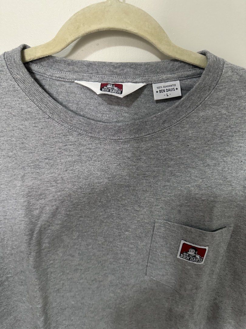 Ben Davis Grey Pocket T-Shirt Size L (Category: Tshirts & Polo Shirts ) located in Mandaluyong City. Submitted by p_dcltrs (Listing ID 1458750075, Image 2). Description: - Classic grey Ben Davis pocket tee - Size: Large (L) - Simple and durable design - Ideal for everyday wear - Features iconic Ben Davis logo on chest pocket - Made from good quality cotton - Versatile and easy to pair with any outfit - L 27” x W 20”.