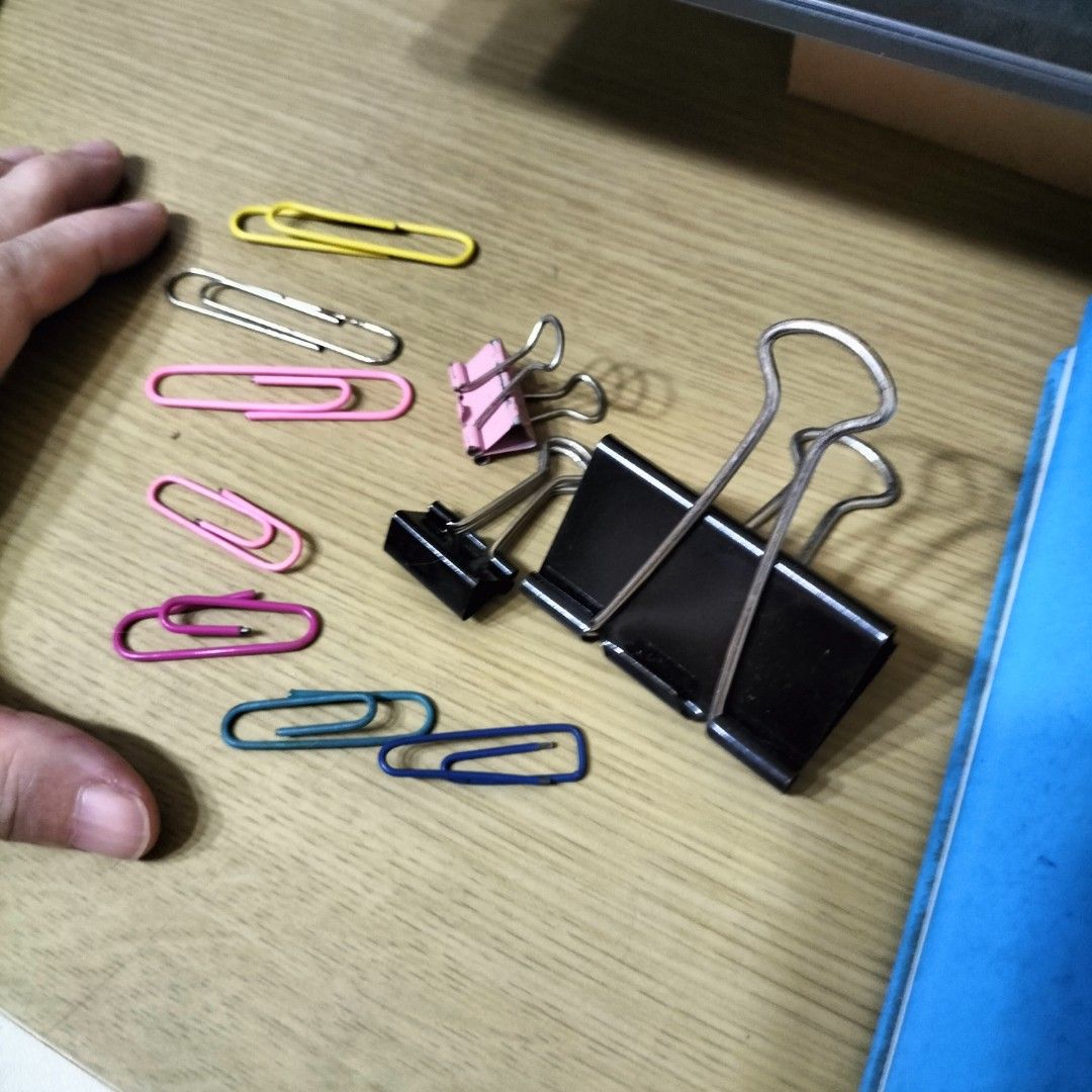 Binder Clips and Paper Clips Assortment (Category: Craft Supplies & Tools) located in Paranaque City. Submitted by decluttering-all (Listing ID 1458722381, Image 2). Description: - Assorted binder clips in black and pink. - Variety of paper clips in yellow, silver, pink, purple, teal, and blue. - Ideal for organizing documents at home or in the office. - All items are in good, usable condition. free when you buy p100 worth decluttering pick up be