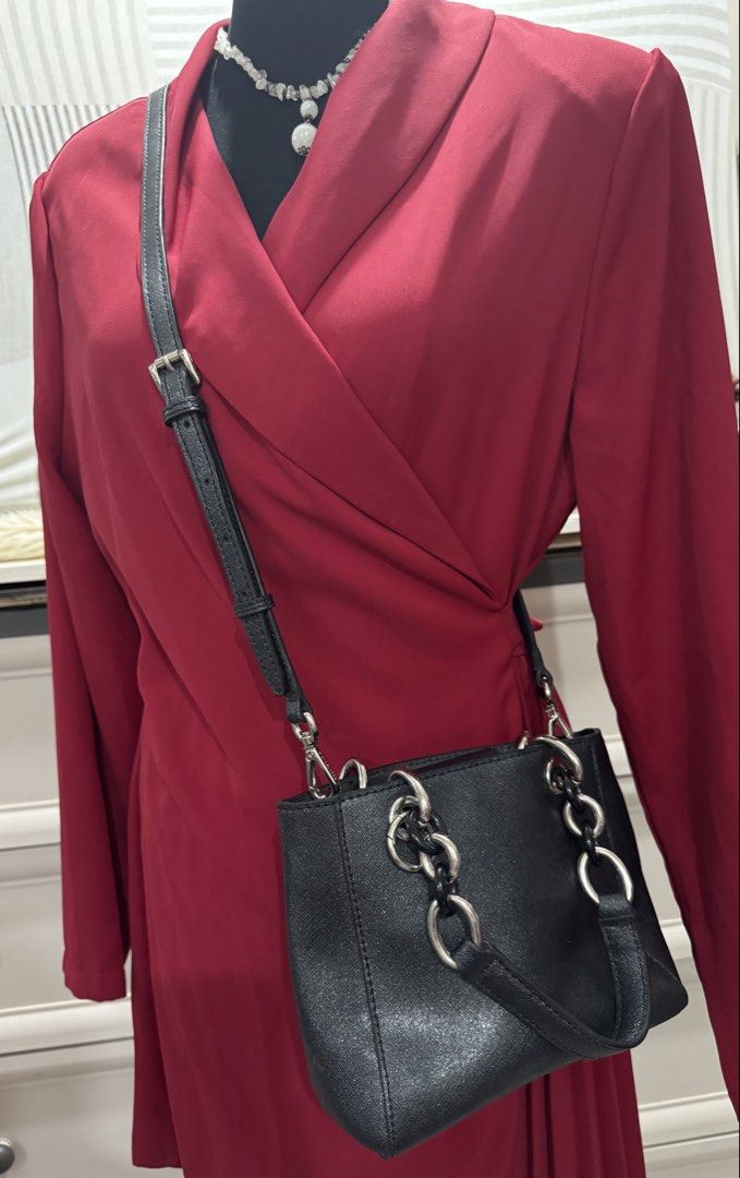 Black Michael Kors Handbag with Silver Hardware (Category: Luxury Bags & Wallets) located in Cauayan City . Submitted by espiritucj (Listing ID 1458849991, Image 3). Description: - Authentic Black Michael Kors Handbag - Elegant Silver Chain Details - Detachable Strap for Versatile Wear - Multiple Interior Compartments for Organization - Subtle Shimmering Material - Ideal for Everyday or Evening Use - Immaculate Condition (Clean Inside and Out) - 
