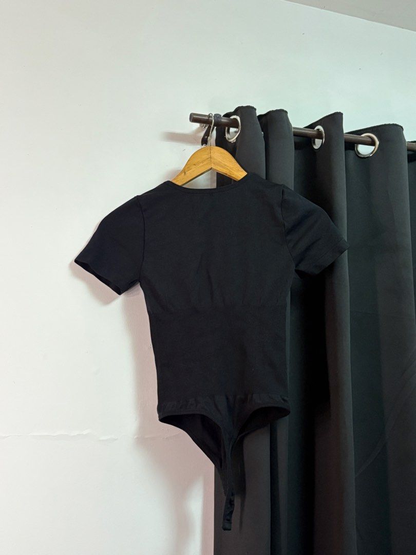 Black Short Sleeve Cutout Bodysuit (Category: Others Tops) located in Manila. Submitted by jeweeeel (Listing ID 1458799078, Image 1). Description: - Sleek black short sleeve bodysuit - Flattering chest cutout detail - Ribbed waist for a slimming effect - Comfortable and stretchy fabric - Thong bottom for a seamless look - Versatile for layering or wearing alone.