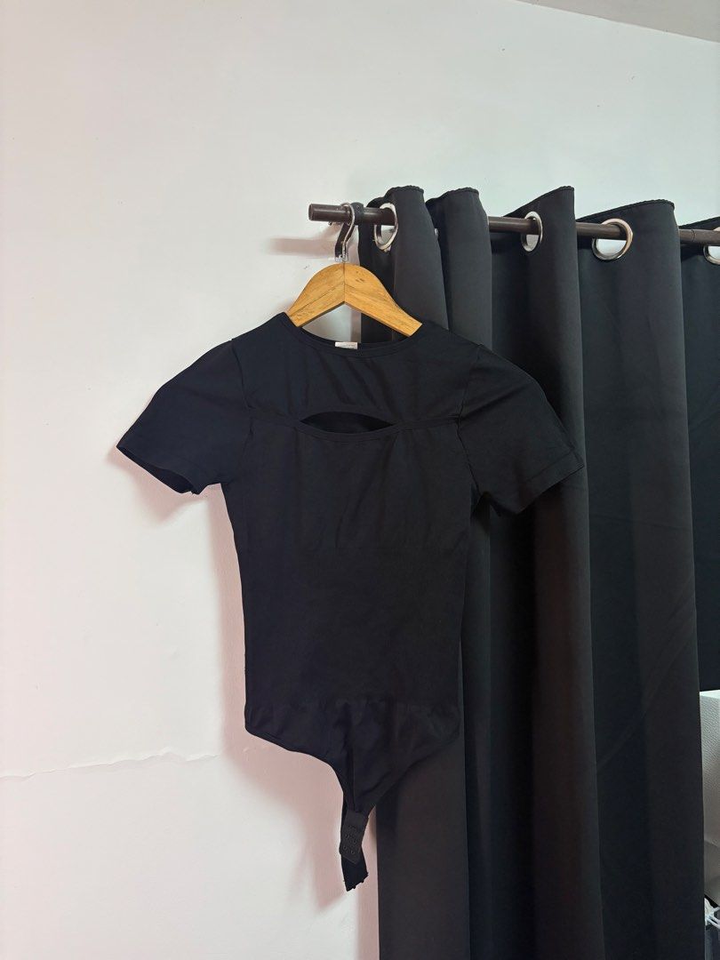 Black Short Sleeve Cutout Bodysuit (Category: Others Tops) located in Manila. Submitted by jeweeeel (Listing ID 1458799078, Image 2). Description: - Sleek black short sleeve bodysuit - Flattering chest cutout detail - Ribbed waist for a slimming effect - Comfortable and stretchy fabric - Thong bottom for a seamless look - Versatile for layering or wearing alone.