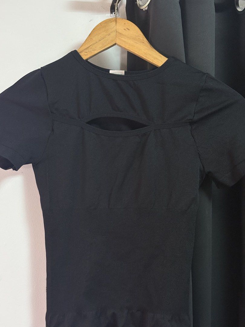 Black Short Sleeve Cutout Bodysuit (Category: Others Tops) located in Manila. Submitted by jeweeeel (Listing ID 1458799078, Image 3). Description: - Sleek black short sleeve bodysuit - Flattering chest cutout detail - Ribbed waist for a slimming effect - Comfortable and stretchy fabric - Thong bottom for a seamless look - Versatile for layering or wearing alone.