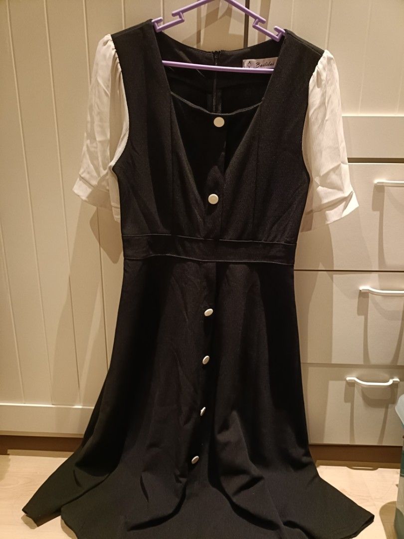 Black Square Neck Button Front Midi Dress with Puff Sleeves (Category: Dresses) located in Bacoor. Submitted by Miss_Chuch0521 (Listing ID 1458840286, Image 3). Description: - Cute black midi dress - Square neckline - Button-up front - Short puff sleeves - Flared skirt - Versatile for casual or dressy looks - Comfortable and easy to wear.