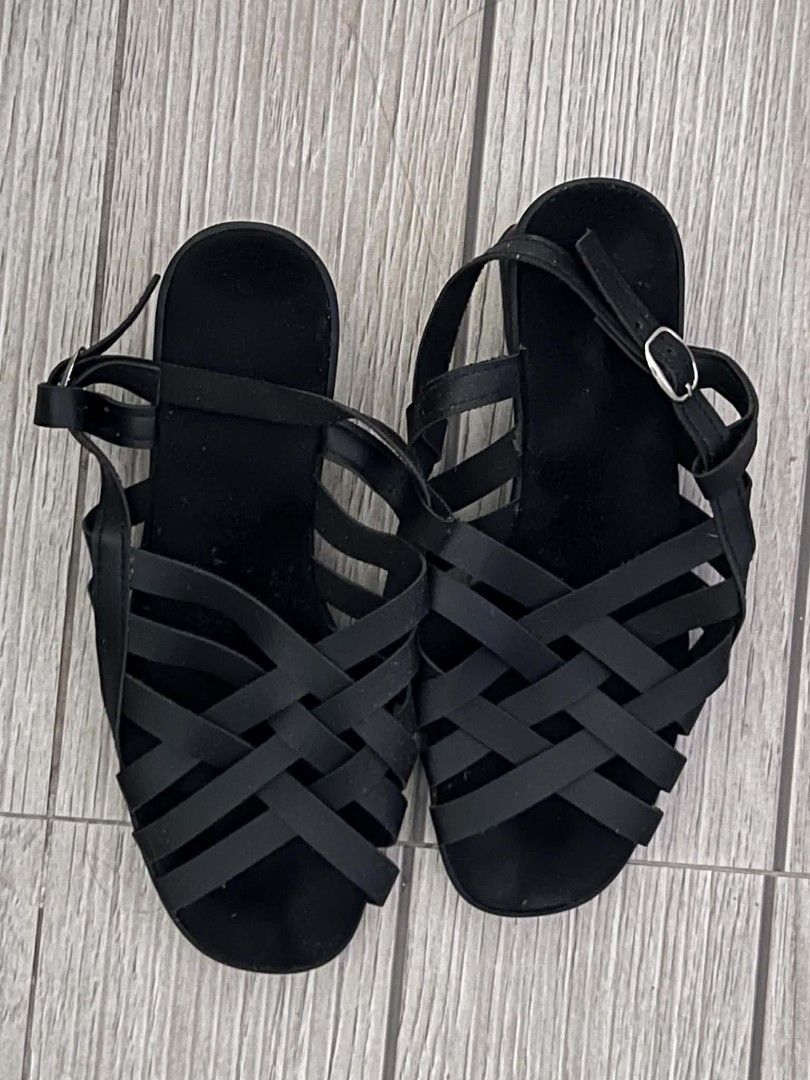 Black Woven Strap Flat Sandals (Category: Flats & Sandals) located in San Jose del Monte. Submitted by Skin_Care2022 (Listing ID 1458701177, Image 2). Description: - Stylish black woven strap design - Comfortable flat sole for all-day wear - Adjustable ankle strap for a secure fit - Easy to slip on and off - Versatile for casual outings or elevating simple outfits.