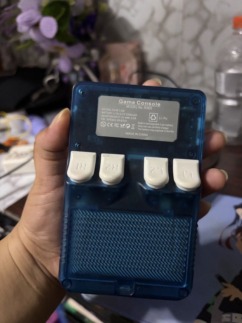Blue RG353VS Handheld Game Console with 22021 Games (Category: Others) located in Manila. Submitted by maker.tt (Listing ID 1458824818, Image 3). Description: - Blue transparent RG353VS handheld game console - Pre-loaded with 22021 games - Perfect for retro gaming on the go - Includes D-pad, analog sticks, and shoulder buttons - Built-in rechargeable Li-Po battery.